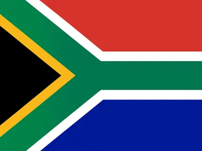 The flag of South Africa featuring horizontal bands of red and blue, a green Y-shape with white borders, and a black triangle with a yellow border on the left.